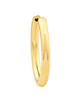 Gold hoop earring on a white background