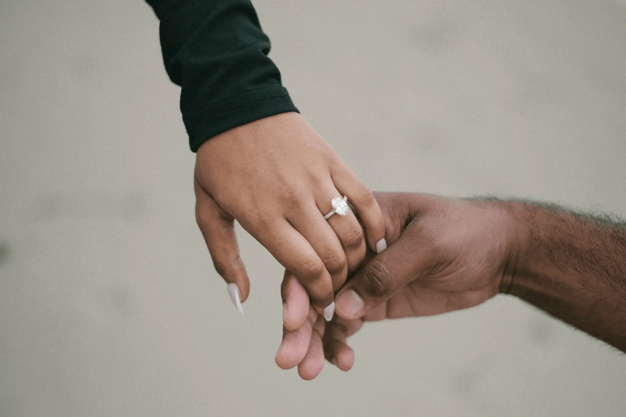 women getting engaged with an oval diamond ring