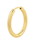 Gold hoop earring on a white background