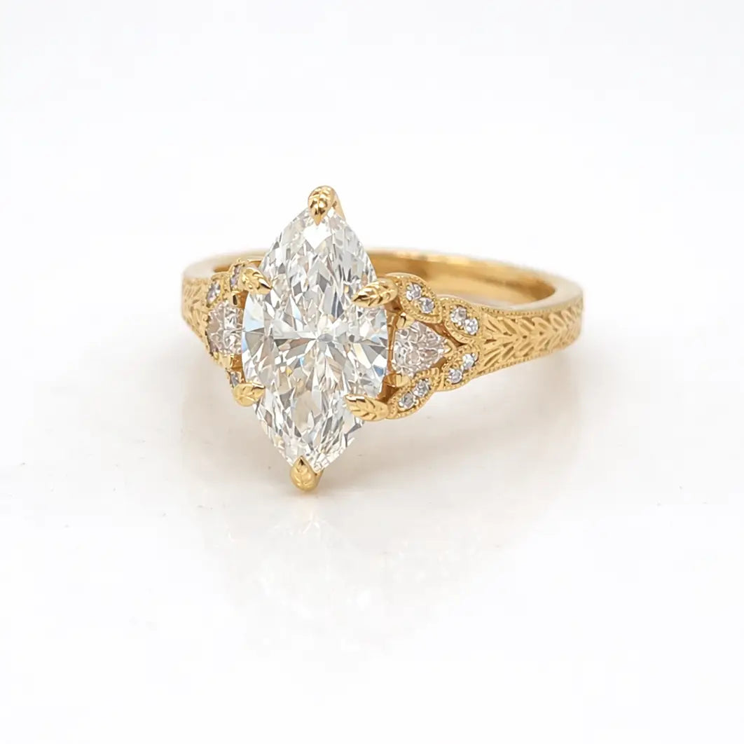 Gold ring with a large marquise diamond center stone 