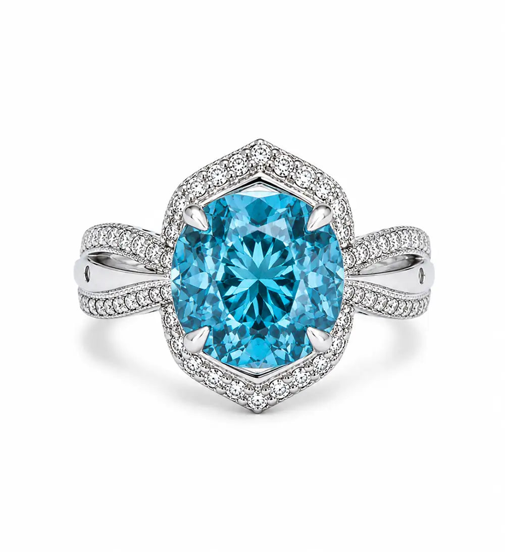Ring with a blue zircon gemstone and diamond band on a white background